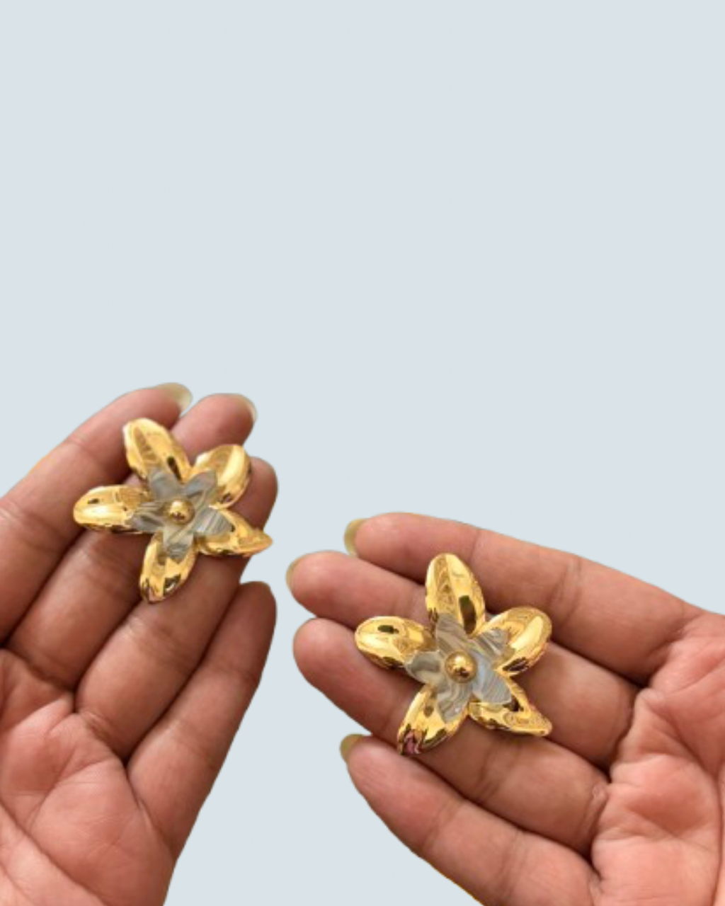 Minimalist ivory layered bloom gold studs held in hand to show scale - Trinketly BD
