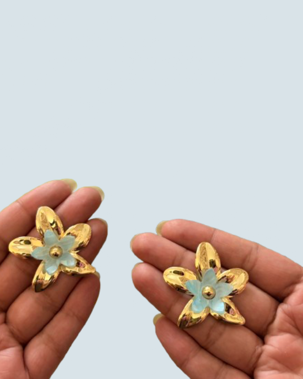 Minimalist ivory layered bloom gold studs held in hand to show scale - Trinketly BD
